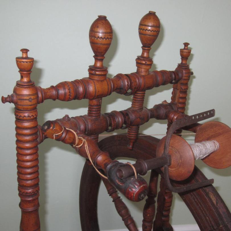 Swiss wheel, with metal flyer and carved floating rings