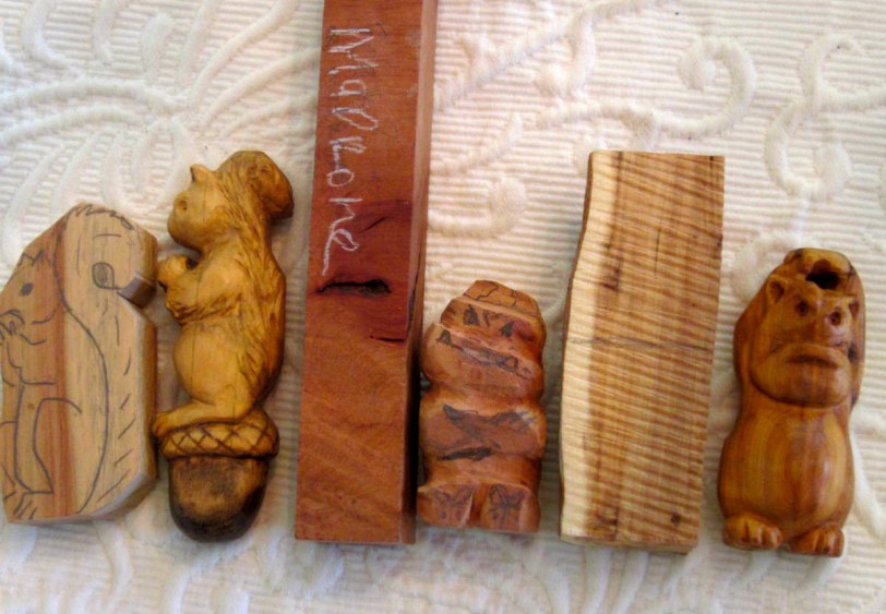 Carvings in progress.   A nearly complete SQUIRREL in Australian Cypress.  GREMLIN in madrone burl.  GREMLIN in yew.  Note the pale outer rim of the yew - so the Gremlins backside is pale too.